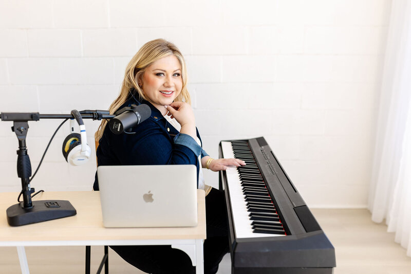 amanda macdowell playing piano in front of microphone