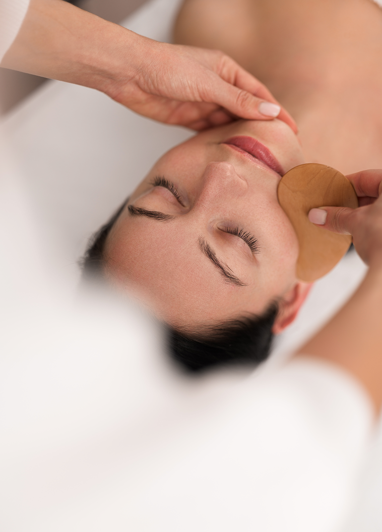 anonymous-cosmetologist-using-wooden-gua-sha-massa-2025-03-18-14-26-40-utc 1