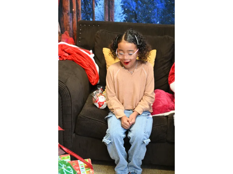 little girl excited for a gift from Santa