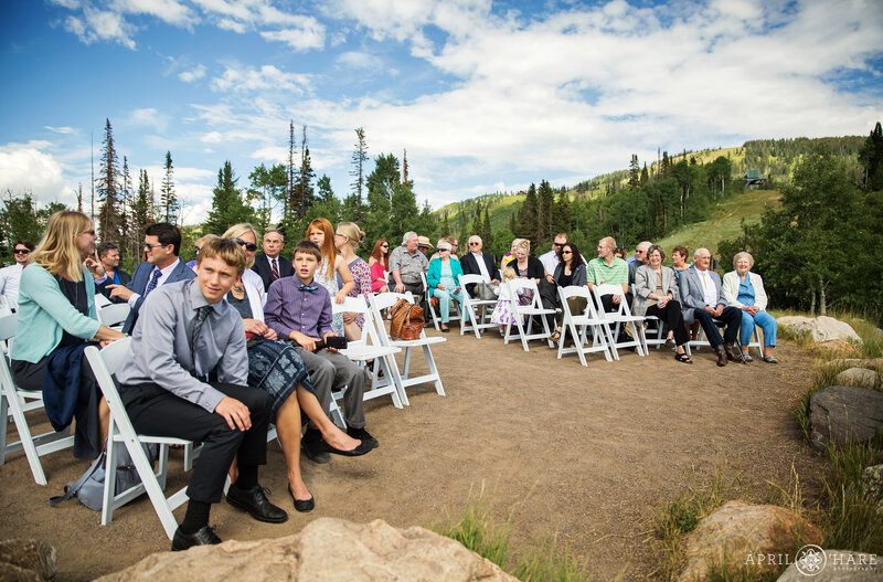 Guests seated and waiting for a wedding ceremony to begin at the Vista Overlook at Steamboat Springs Resort in Colorado
