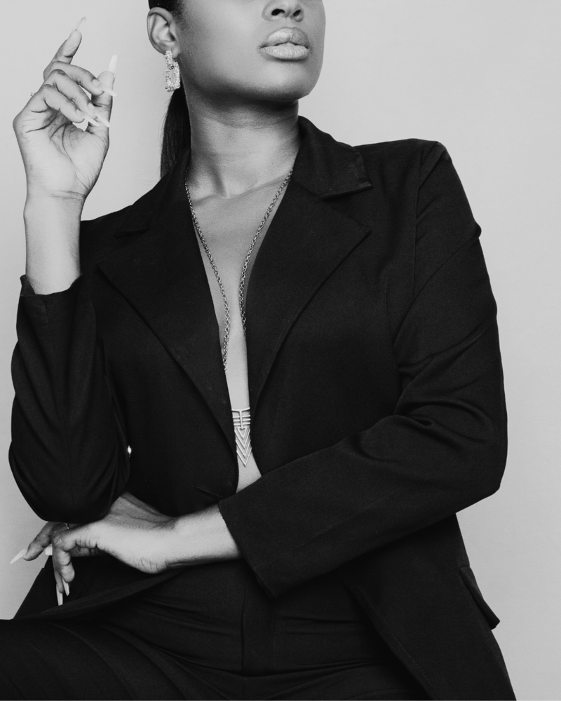 Stock image of a confident Black woman embodying self-love, power, and Main Character Energy, reflecting the bold, empowered transformation Letitia Hopkins helps women achieve.