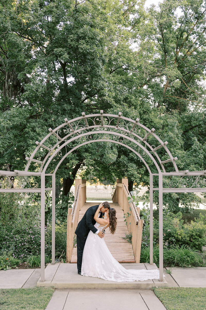 Bride and groom portraits at the bridge at Wolf Lakes Park