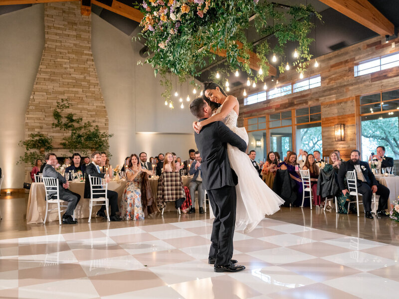 Reception decor in Canyonwood Ridge hall with romantic lighting and Hill Country details