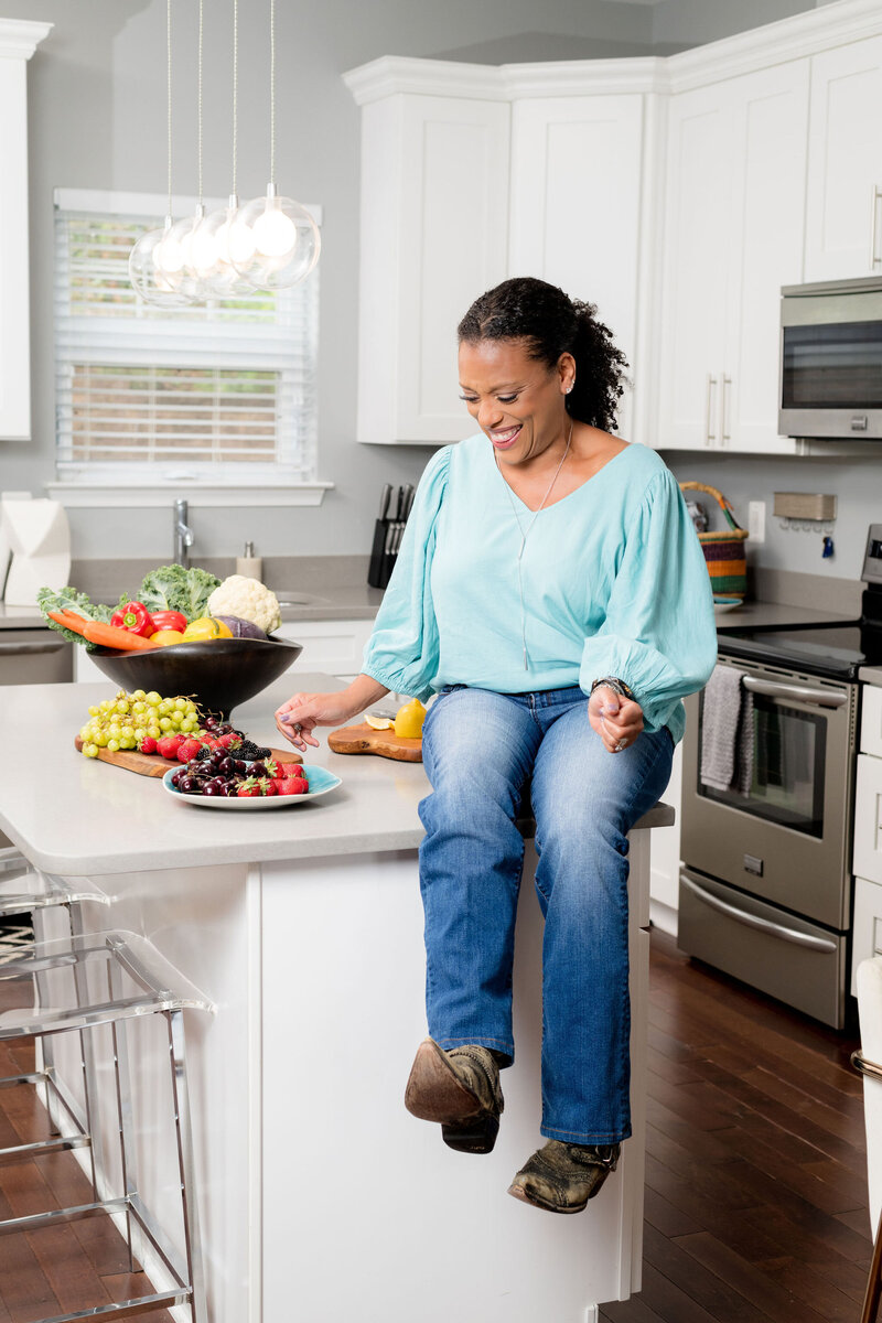Plant-based and holistic wellness coach gwen fields enjoying healthy food.