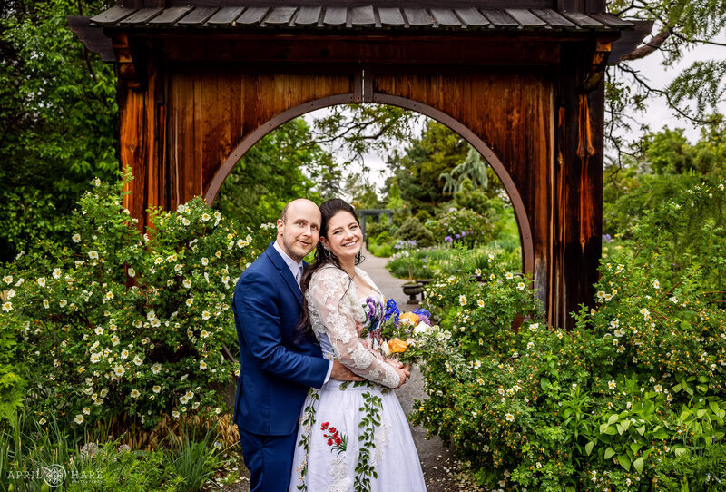 Rainy Wedding Day Portrait with Circle Gate at Denver Botanic Gardens