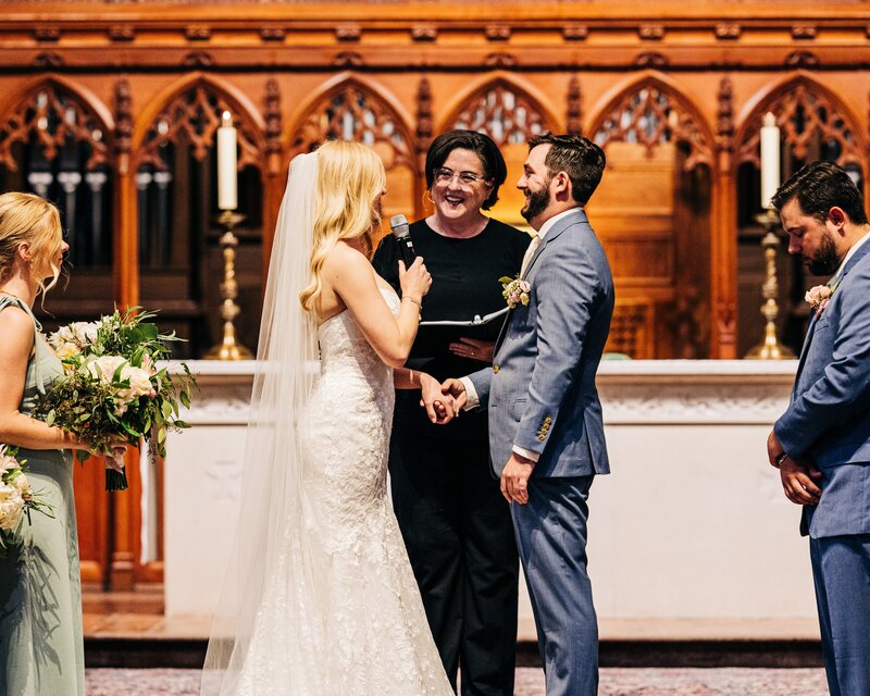 Reverend Rachel Tatge officiates an outdoor wedding ceremony