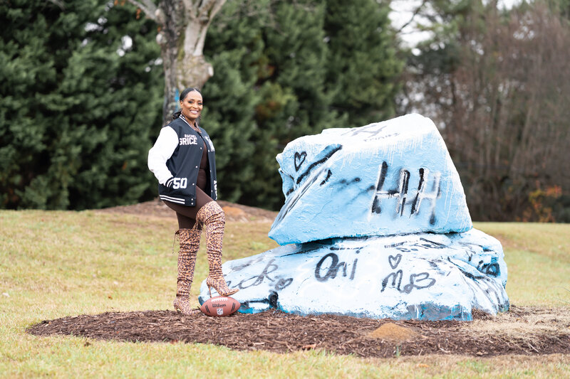 50th milestone birthday photoshoot woman wearing letterman jacket