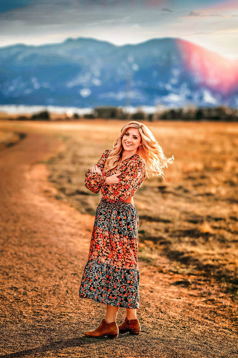 Heather posing outdoor in floral dress at Davidson mesa open space.