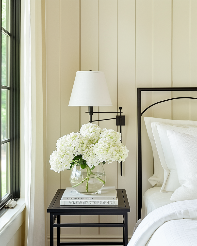 Refined entryway and staircase design in Roswell, Georgia with custom railing, neutral tones, and a warm, welcoming atmosphere by Megan Paterson Interiors.