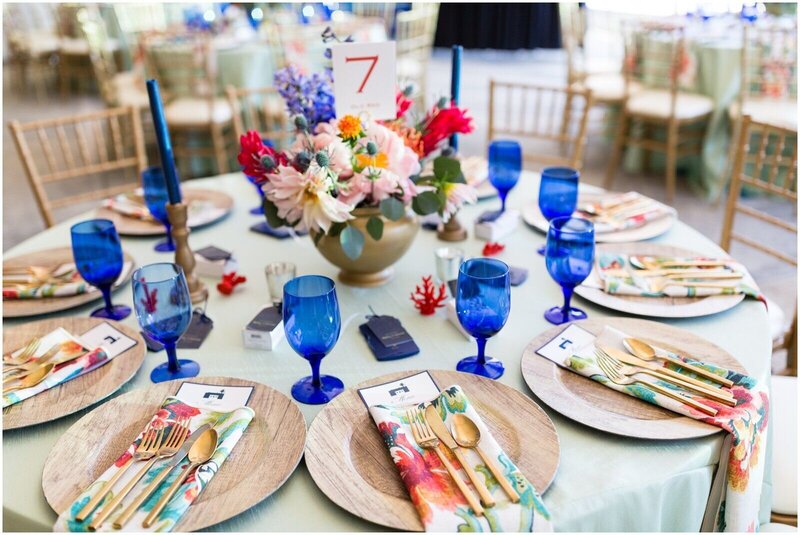 Wedding reception table with bright floral and linen