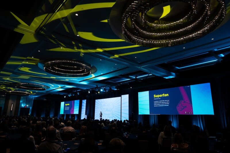 Brittany Hodak delivering her customer experience keynote on stage for Avionte Connect in 2024.