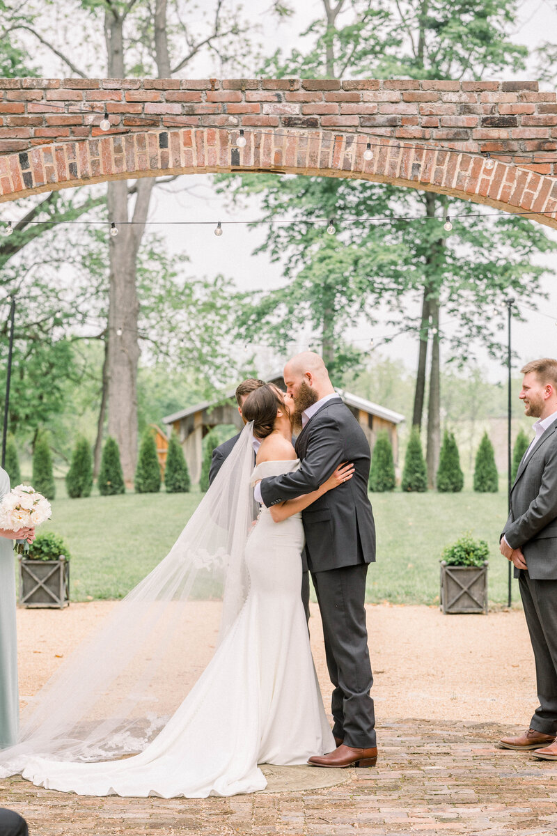 first kiss at micro wedding ceremony