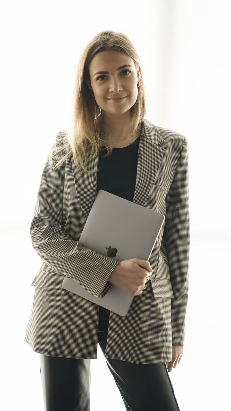 Woman holding her laptop