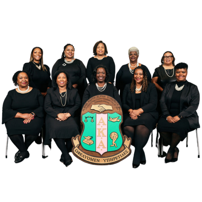 Chapter officers wearing black and sitting behind the AKA sheils