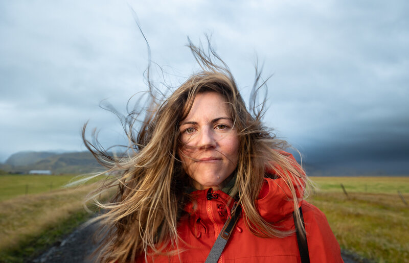 Stephanie Vermillion smiling at camera wearing a dark gray top