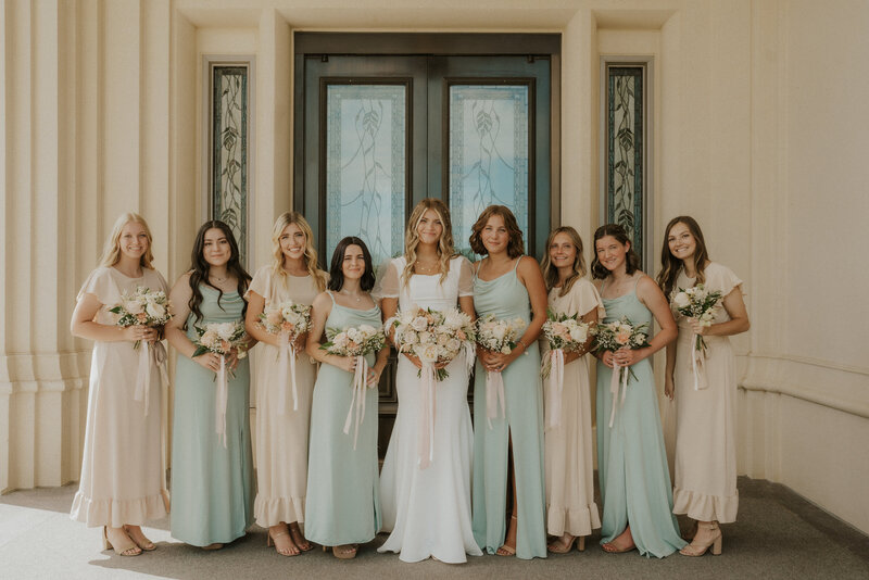 Bridesmaids standing with bride outside of the Payson temple