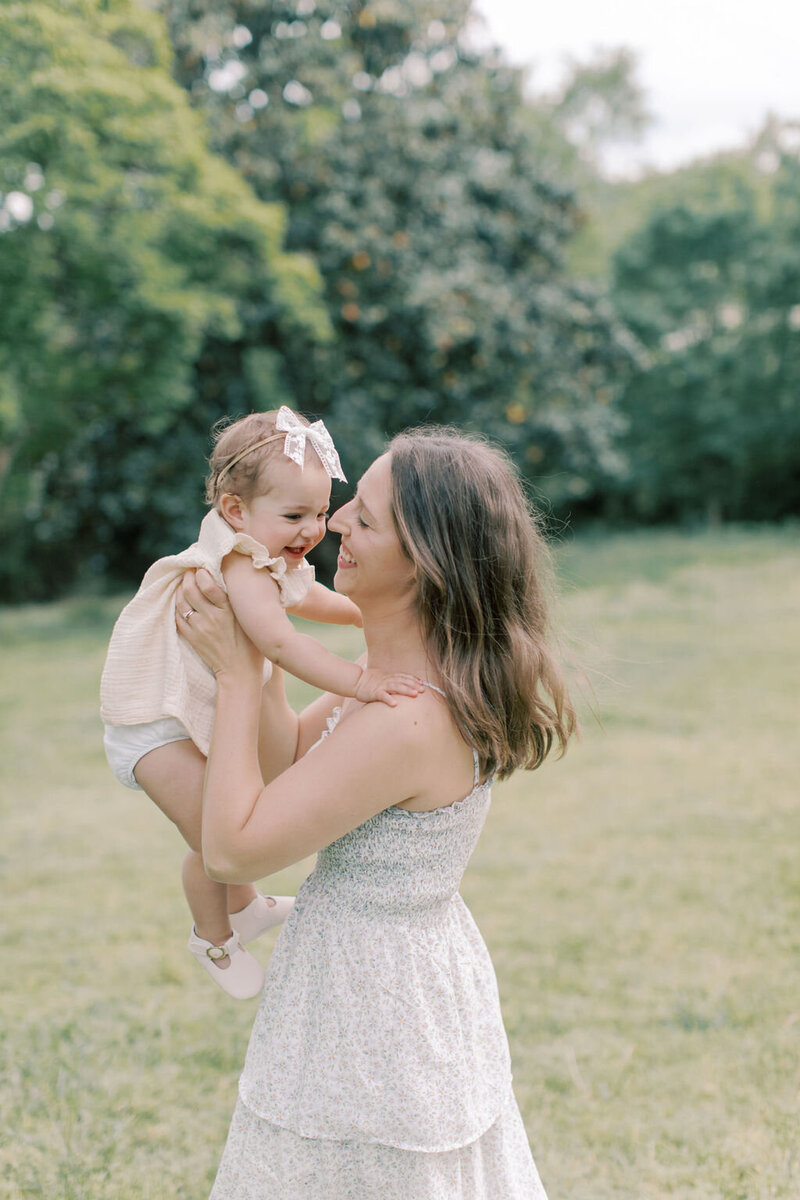 A mother kissing her one year old son during a milestone session at the Virginia House in Richmond, Virginia.