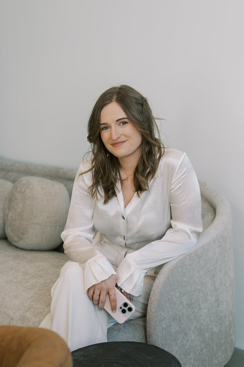 A wedding content creator wearing a blue and white outfit, smiling