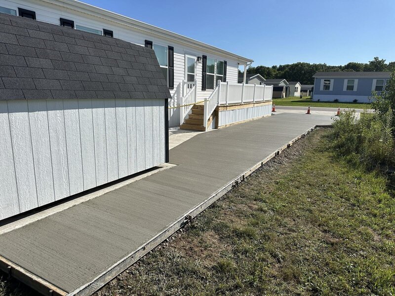 New concrete sidewalk along a manufactured home in Elkhart, IN
