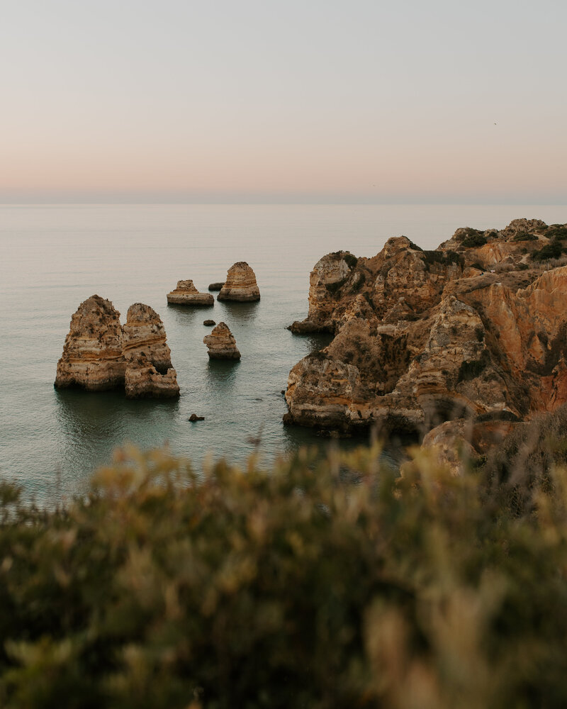 Lagos beach at sunrise with unique rock formations that would make a perfect location for a private first look for an elopement.