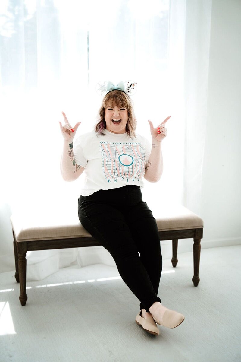 Founder of The Abundance Group & leading business coach for wedding planners poses playfully