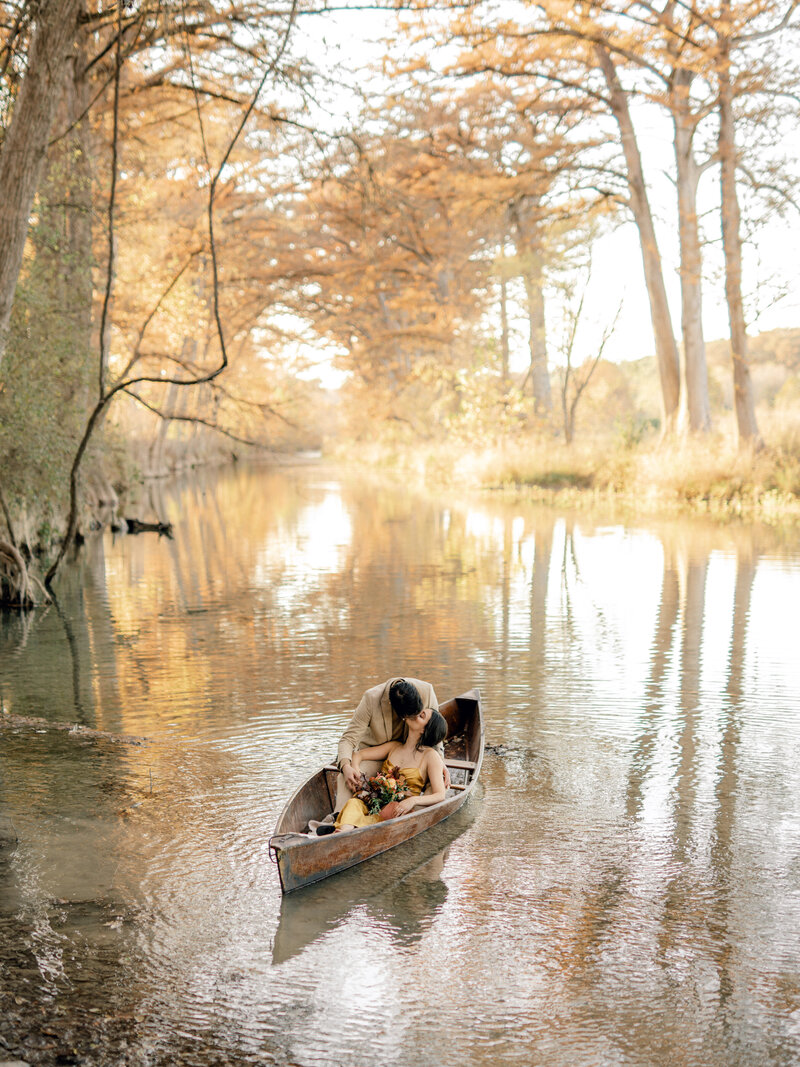 engaged couple in canoe
