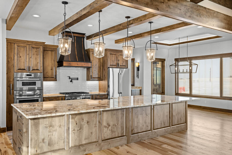 custom rustic kitchen with wood beams and wood cabinets