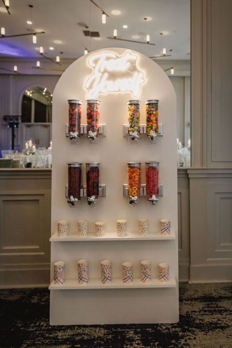 Candy wall with coloful candy cups for wedding guests by Melissa Alison Events.