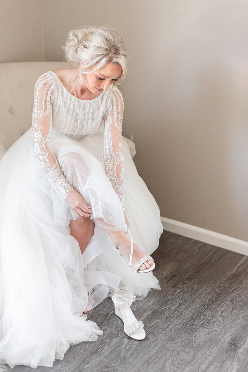 bride getting ready by The Charles Fort Wayne Wedding Photographer Courtney Rudicel