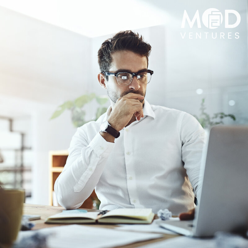 Man reviewing financials as referral to MOD Ventures LLC