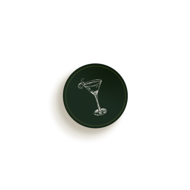 Circular coaster with a drawing of a martini glass and an olive on a green background, perfect for your home office or workspace. Ideal for professionals in digital marketing services for small businesses seeking a stylish touch.