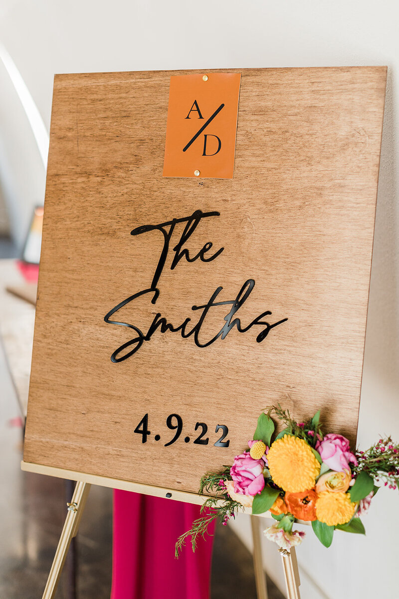 wood welcome sign at wedding