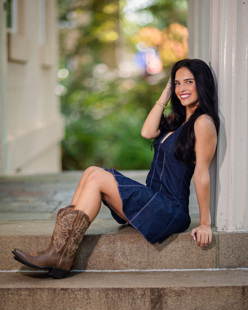 A girl taking her senior portrait at USC in Columbia, South Carolina