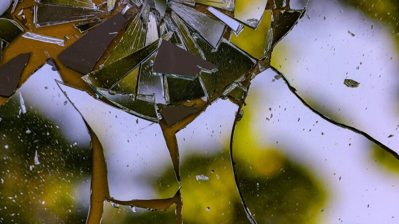 Cracked broken glass texture with sharp fractured lines