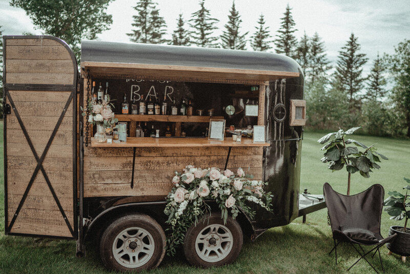 Renovated horse trailer turned into a mobile bar for wedding events.