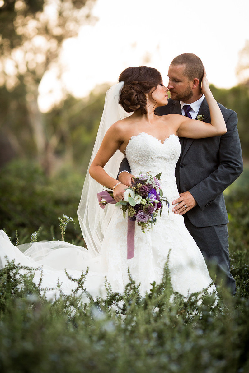 bride and groom serious with back light