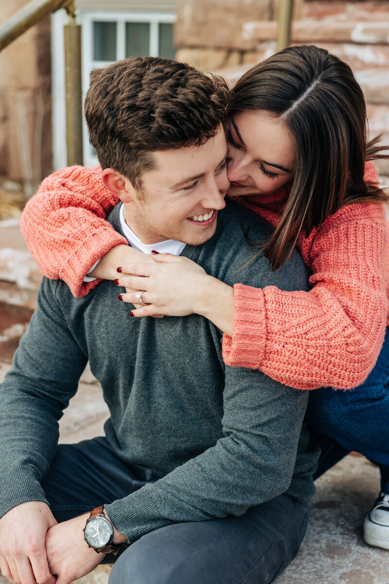 Denver Wedding Photographer captures couple laughing during downtown engagements