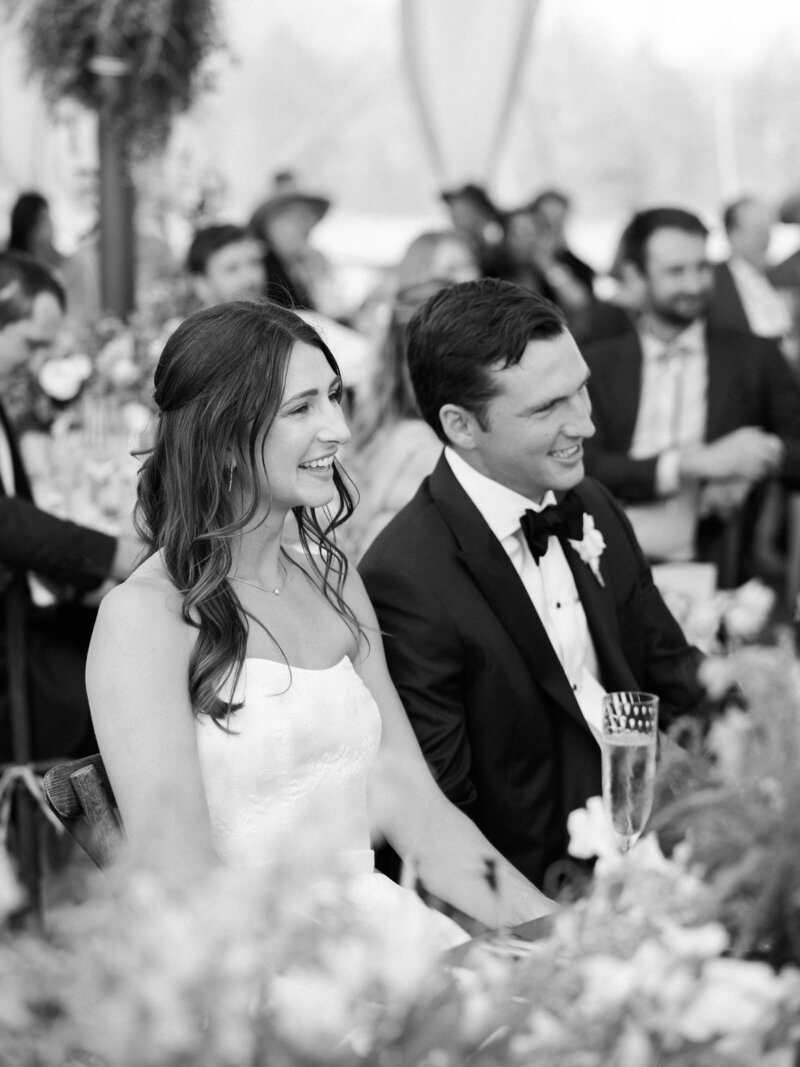 bride dancing with the groom and very happy and smiling in black and white by Colorado Wedding Photographer JKG Photography