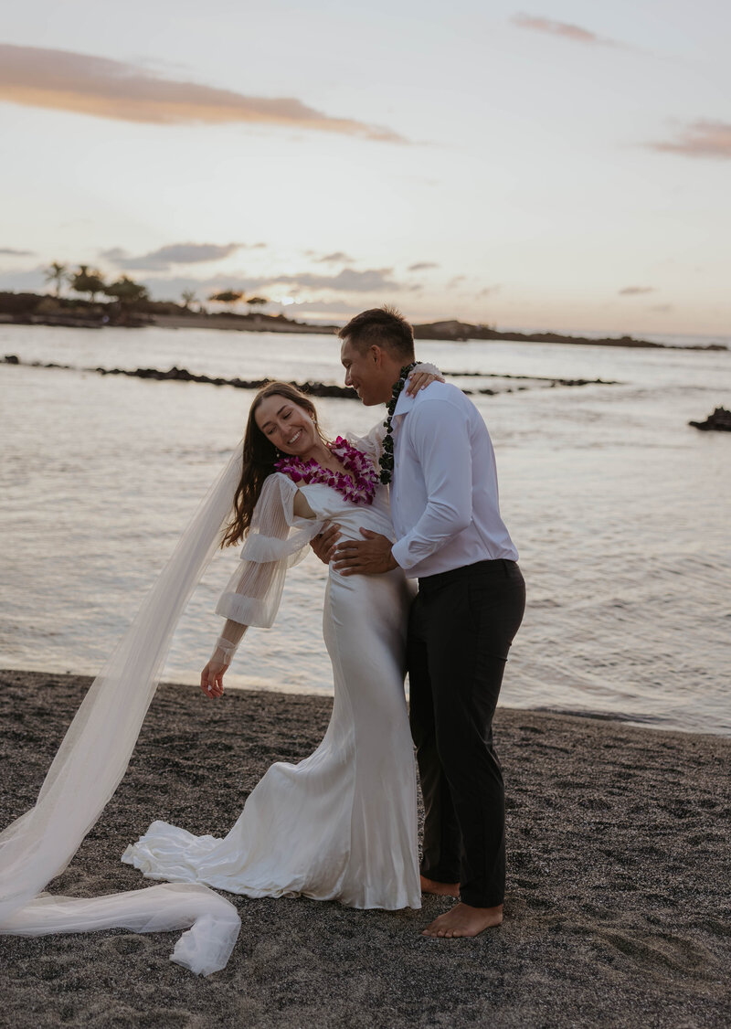 destination wedding photography in Hawaii bride and groom eloping during sunset on the beach