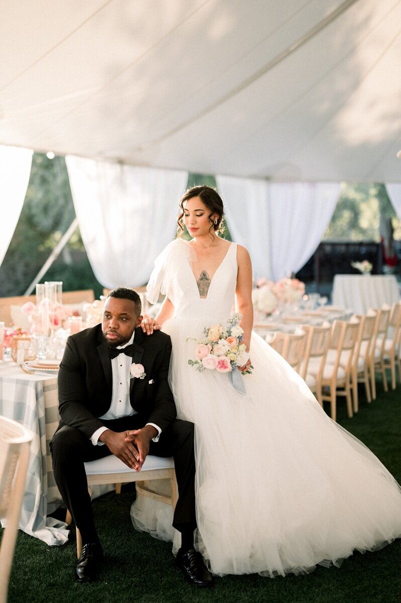 Stylish bride and groom at outdoor wedding reception - Scottsdale fine art wedding photographer.