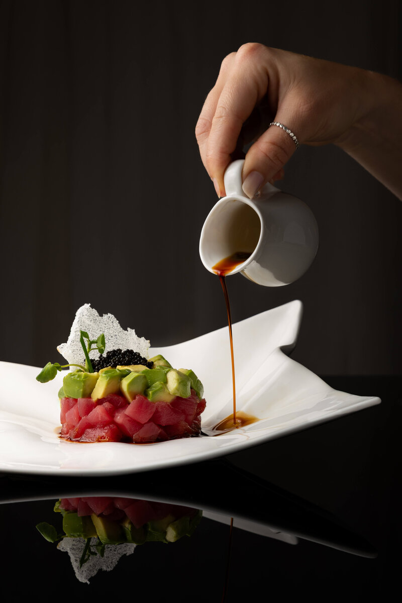 Food photography of tuna and soy sauce drizzle
