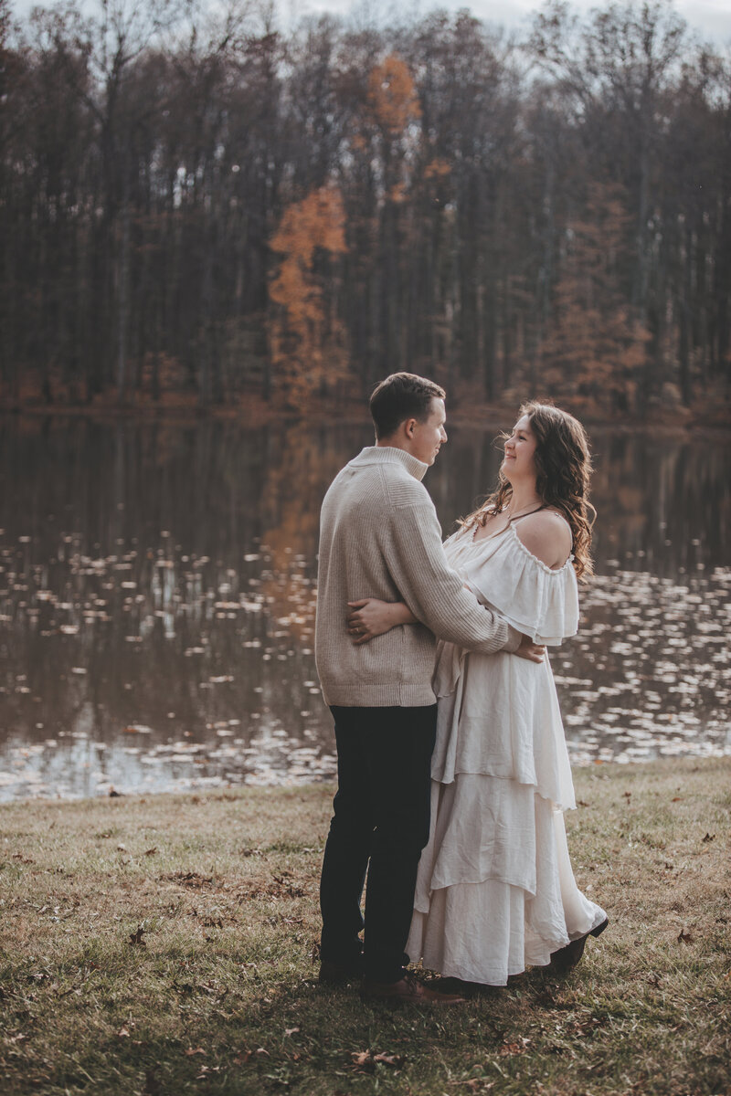 Family Portrait of mom and dad lovingly embracing