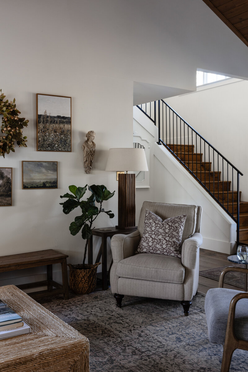 The perfect combination of vintage, new, and found pieces create a cozy, curated nook in this sitting room by Jessa Myer Interiors.