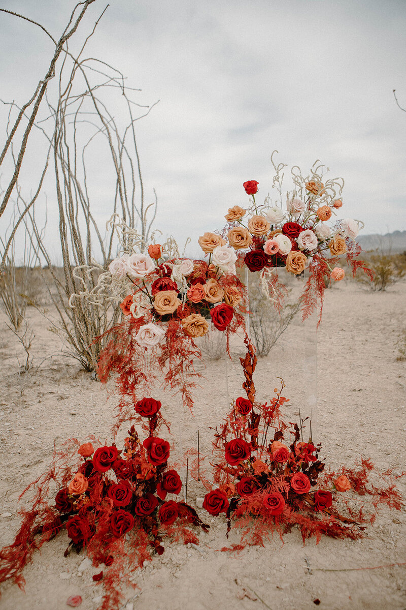 A large and colorful wedding floral installation in the desert of West Texas for an elopement