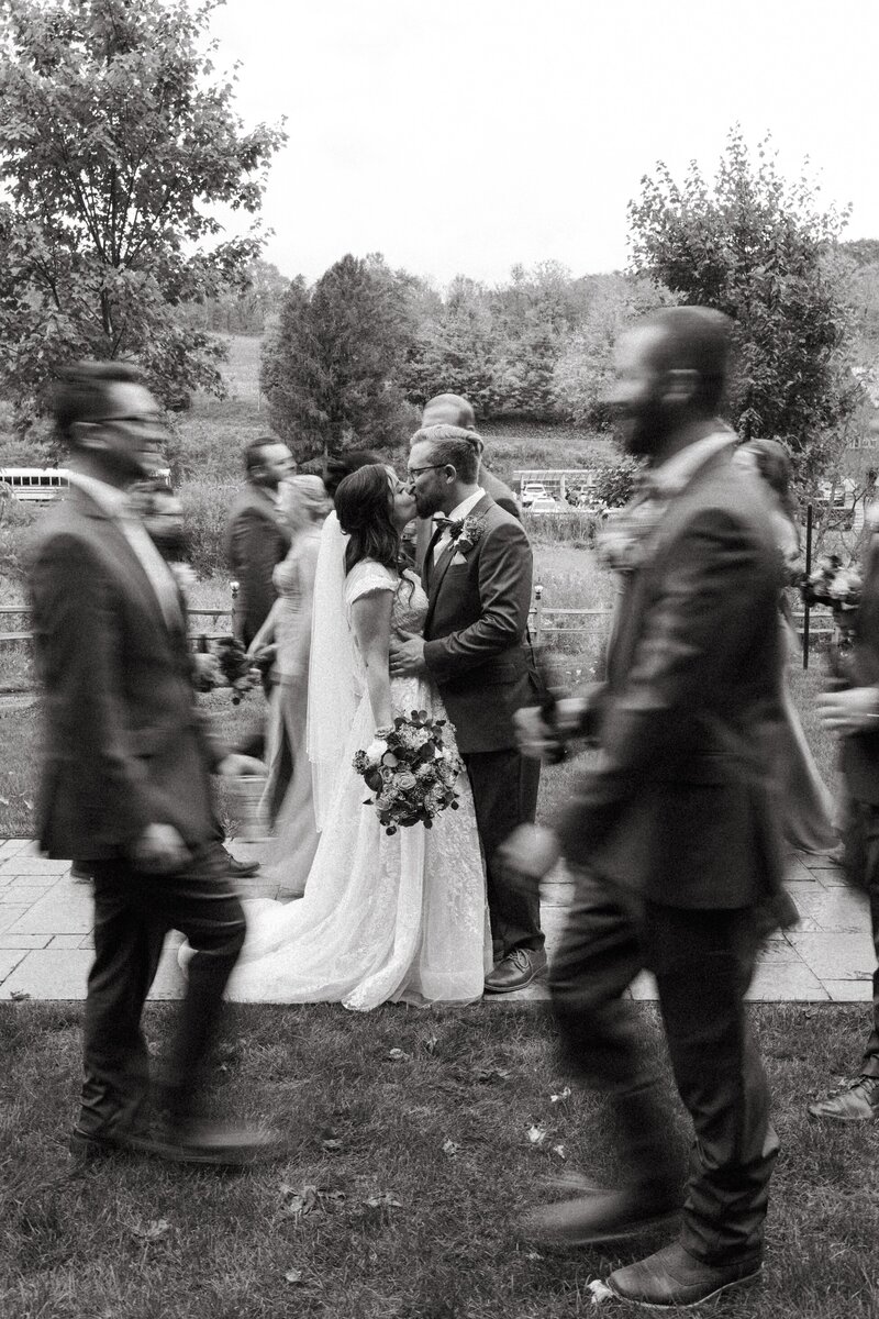 bride and groom pose with bridal party at wedding venue in lancaster pa