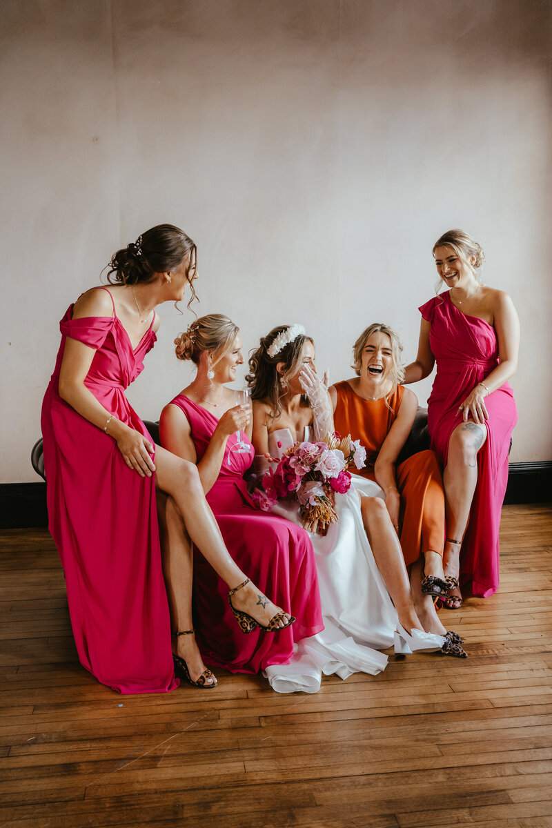 bride and her bridesmaids share a laugh at the Engine Works in Glasgow
