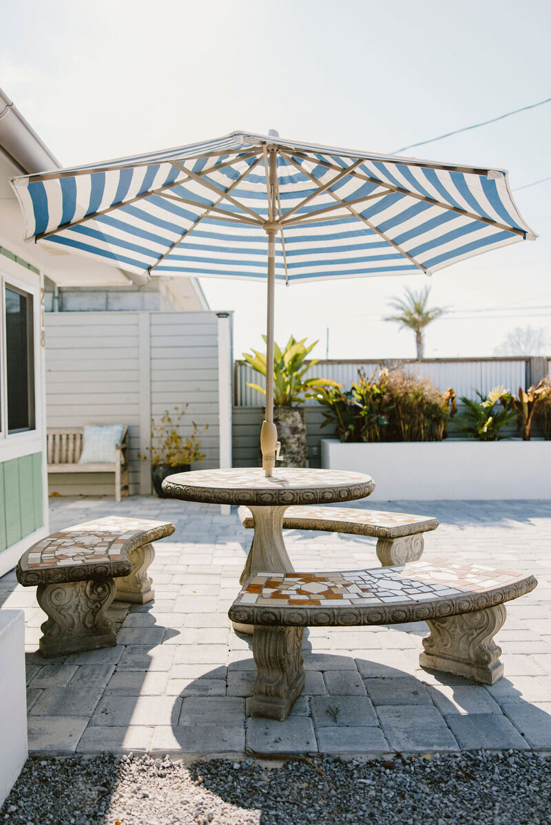 outdoor seating with table and umbrella