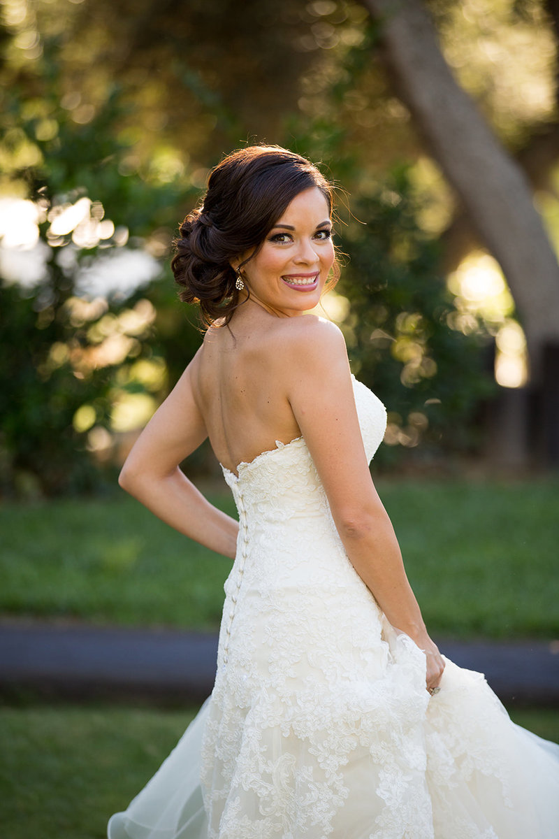 bride smiling looking over shoulder