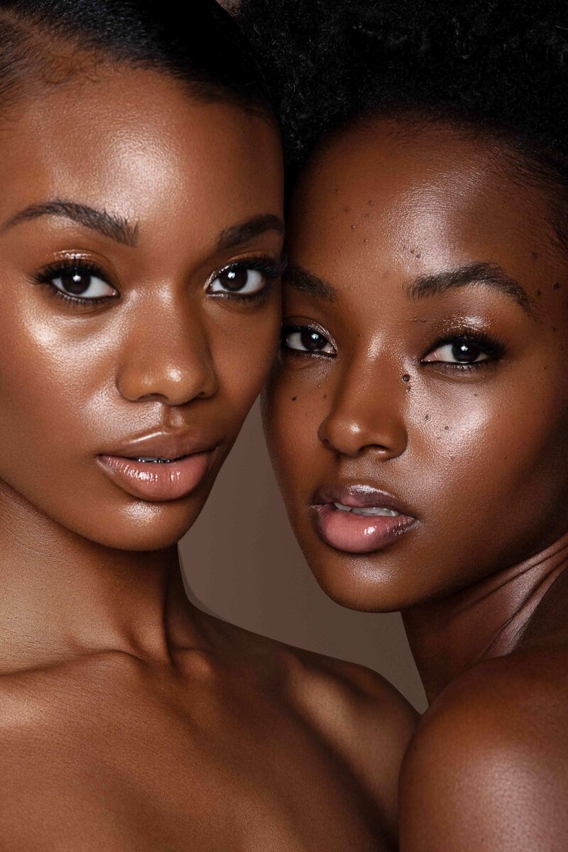 Two beautiful black models with smooth, glowy skin