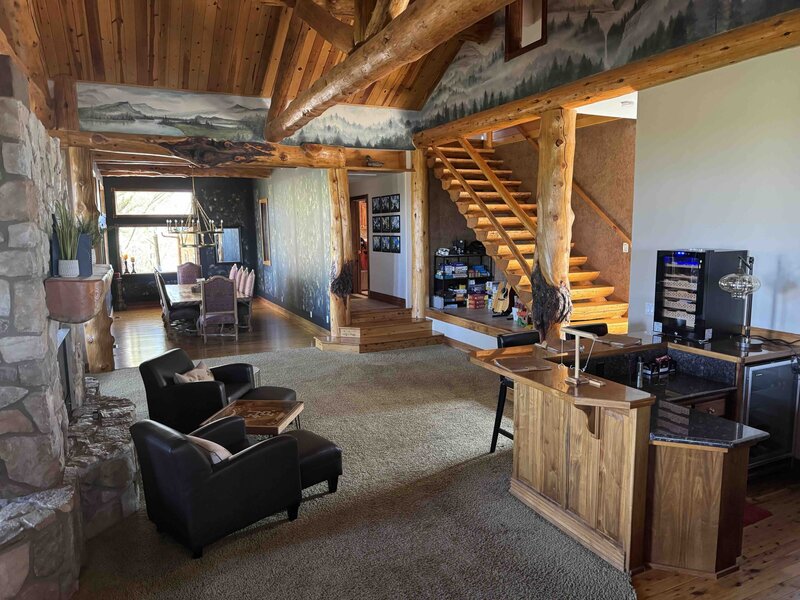 Ground view of a gorgeous stone chateau in a forest. 